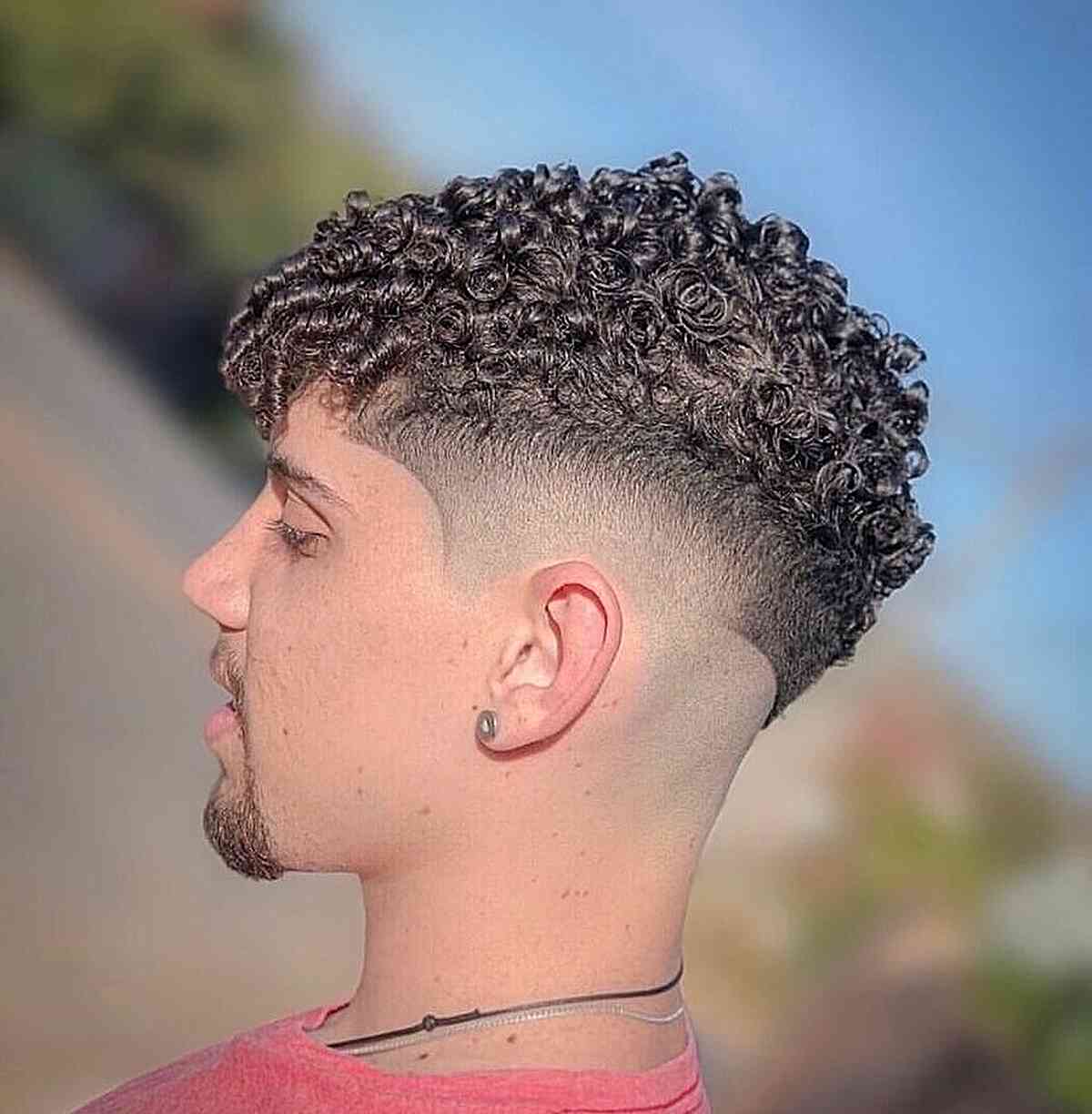 Short Side Bald Fade With Natural Twists for Thick Haired Men