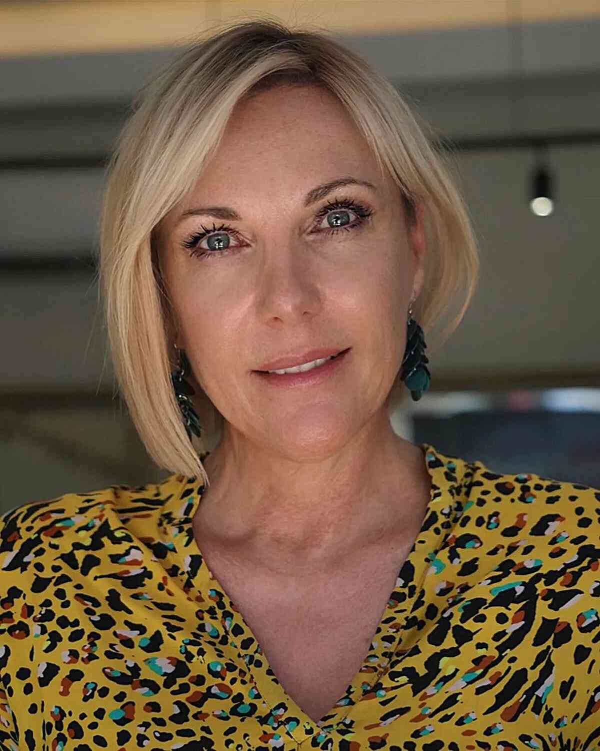 Short Side-Parted Blonde Asymmetric Bob for women over 50 with fine hair