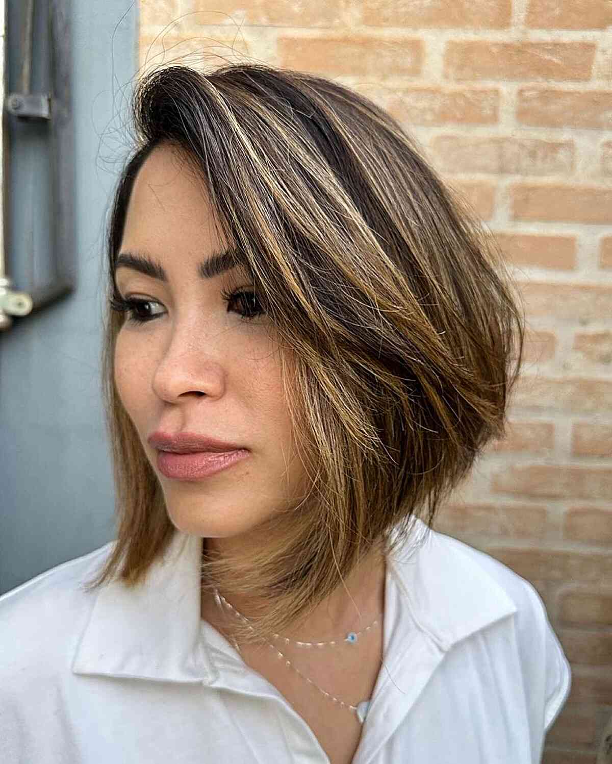 Short Side-Swept Angled Stacked Bob with Subtle Highlights