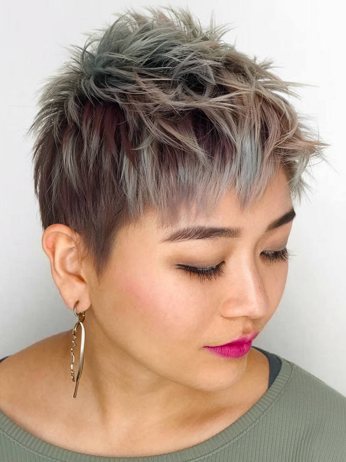 Short spiky haircut with pastel highlights and layered texture