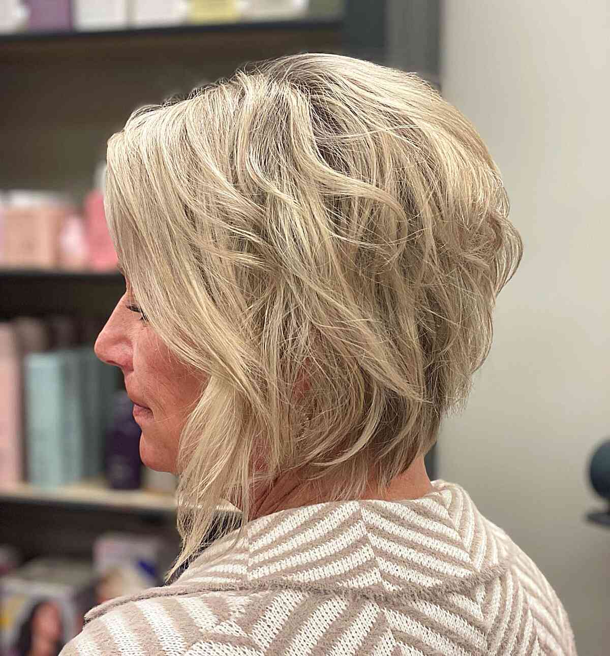 Short Stacked Textured Bob with Long Front Layers on Blonde Hair