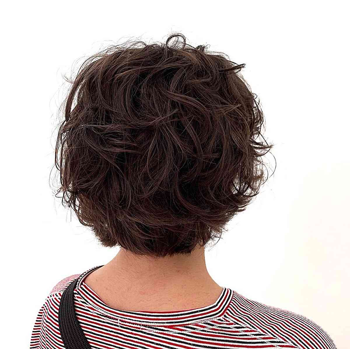 Short Textured Curly Bob with Soft Fringe on Dark-Haired Ladies