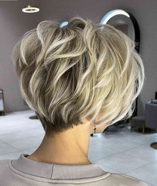 a Short Thick Pixie Bob with Visible Layers for women with short blonde hair