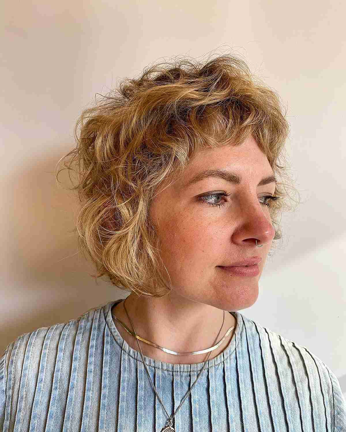 Short Tousled Wavy Layers with Micro Bangs for Chin-Length Hair