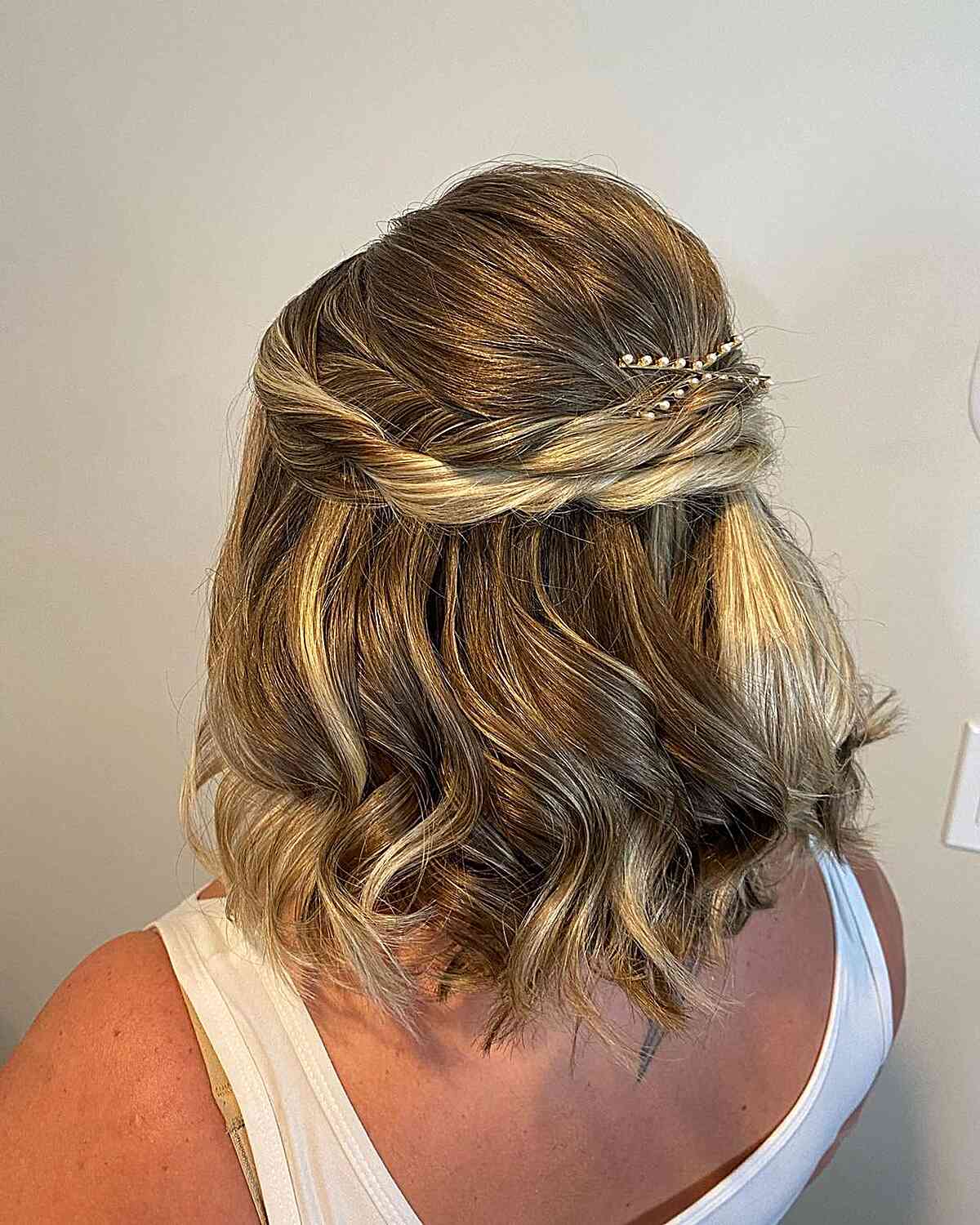 Short Wavy Bob with Double Twist Half Updo for Wedding Guests