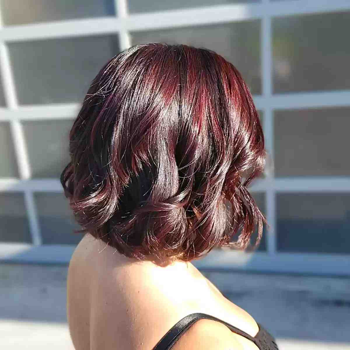Short Wavy Hair with Blended Black and Burgundy Highlights
