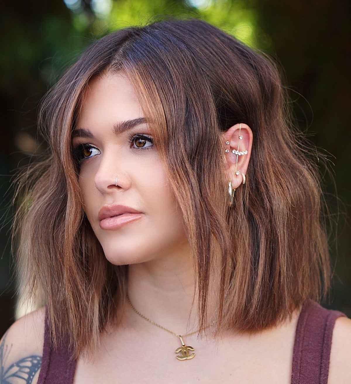 short wavy hair with light brown highlights