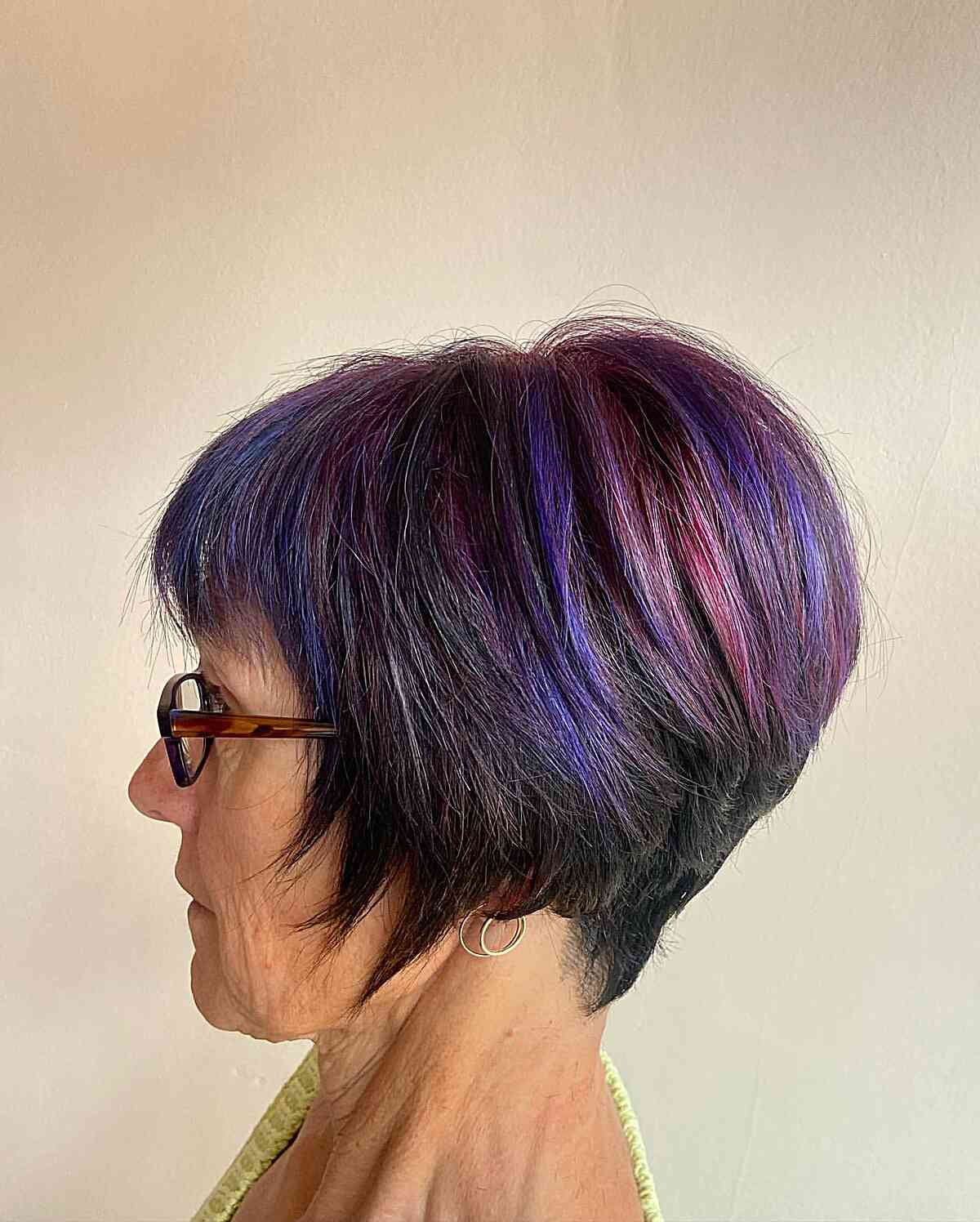 Short Wedge Haircut with Pink and Violet Highlights for Ladies passed their 60s
