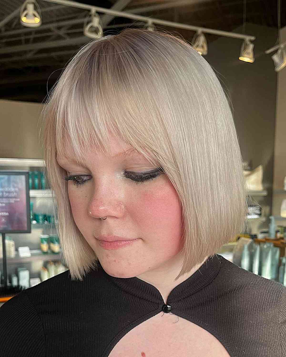 Short White-Blonde Blunt Bob with Choppy Bangs for Round Face Shapes