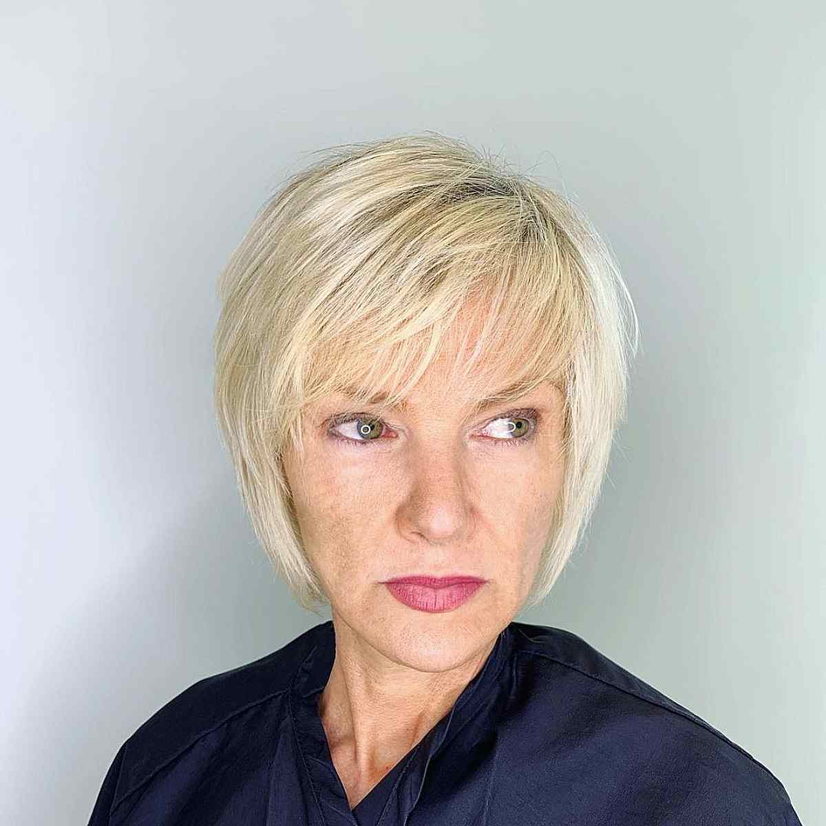Short Wispy Blonde Bob with Side-Swept Bangs for Women 40 and Up