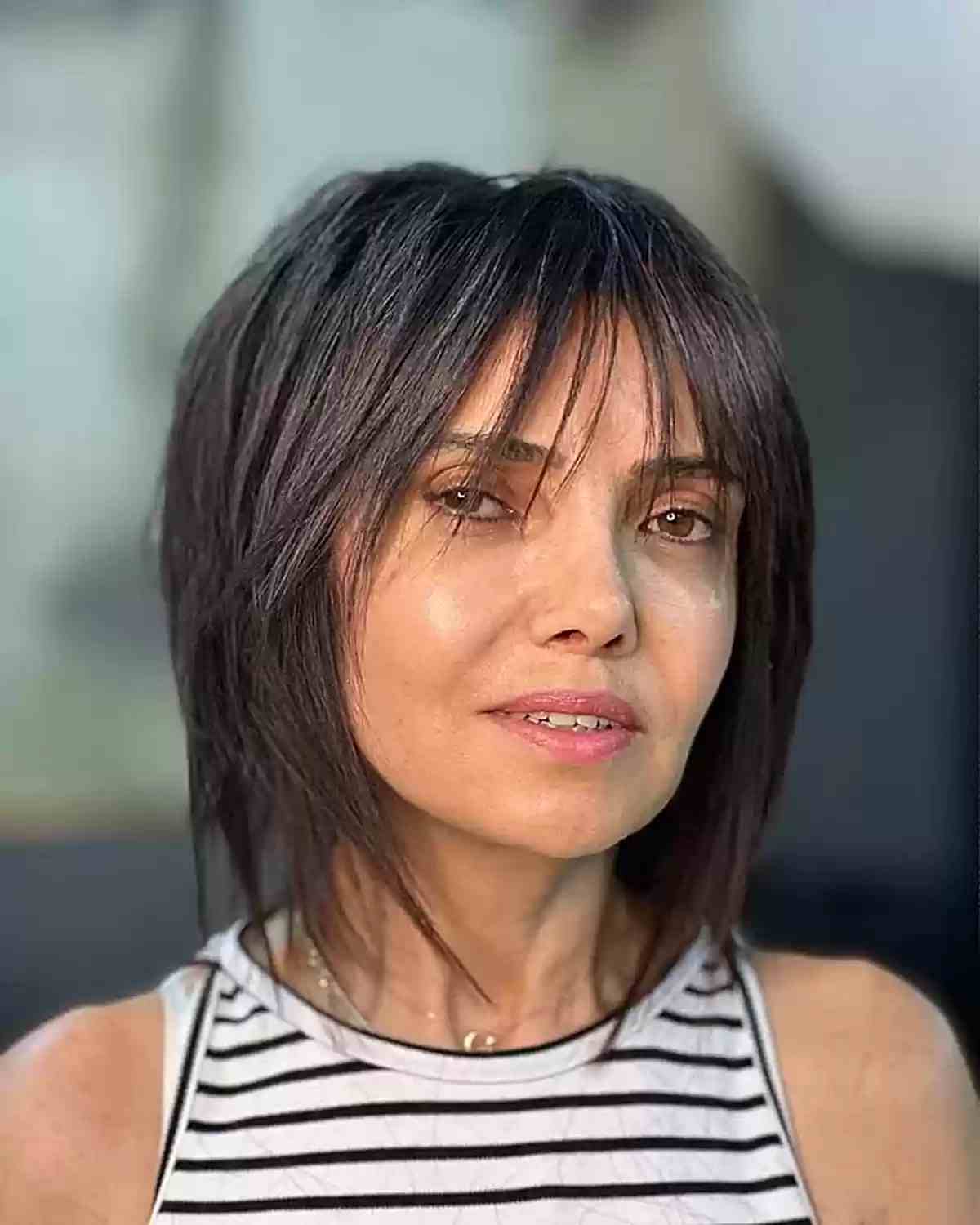 Short Wispy Crop and Bangs for Ladies Aged Forty with straight hair