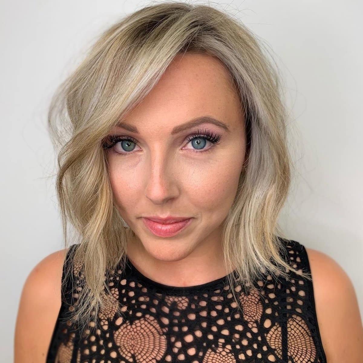 Stunning shorter blunt bob haircut with a side part