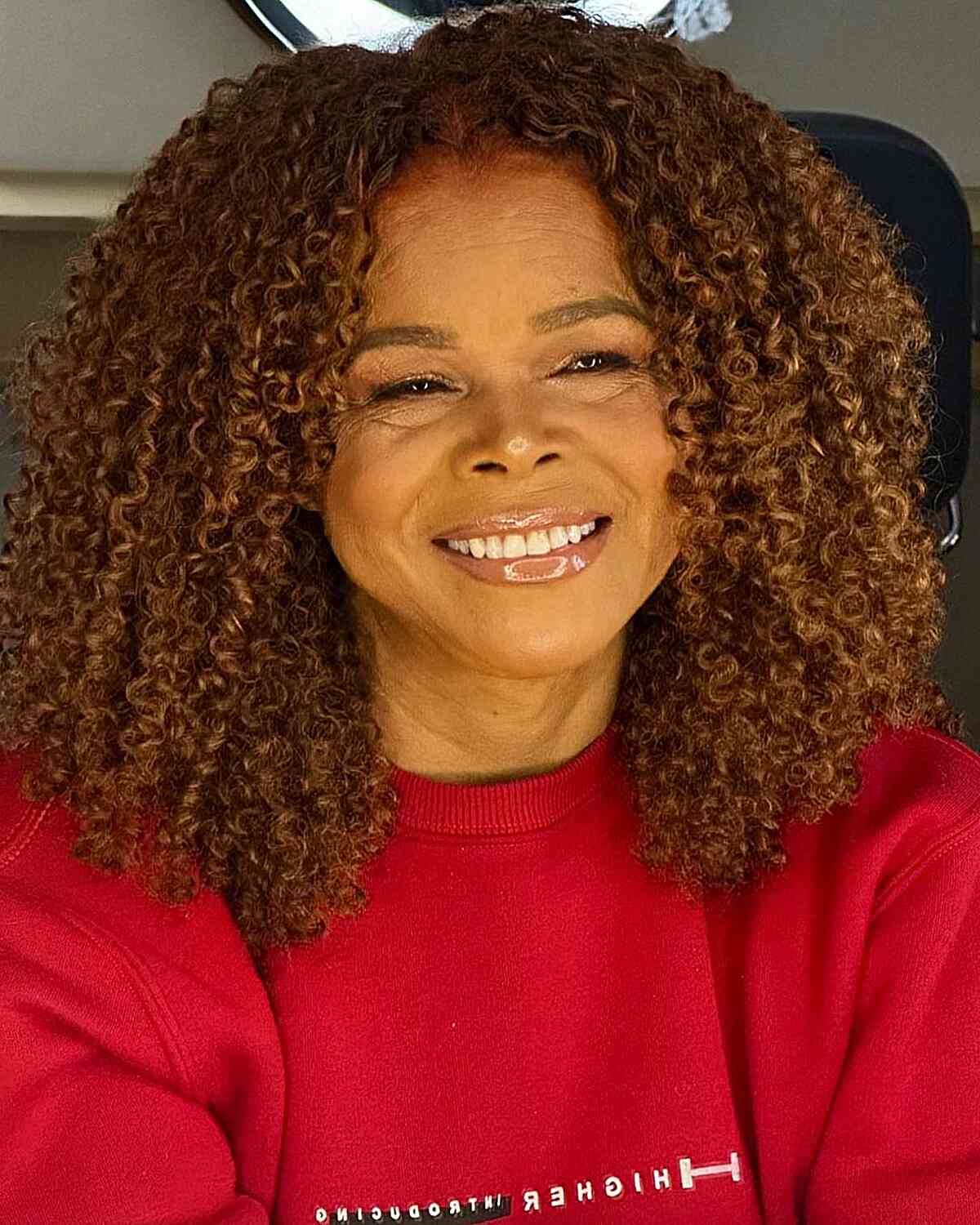 Shoulder-Grazing Layered Curly Cut with Middle Part for Black Women Over 50