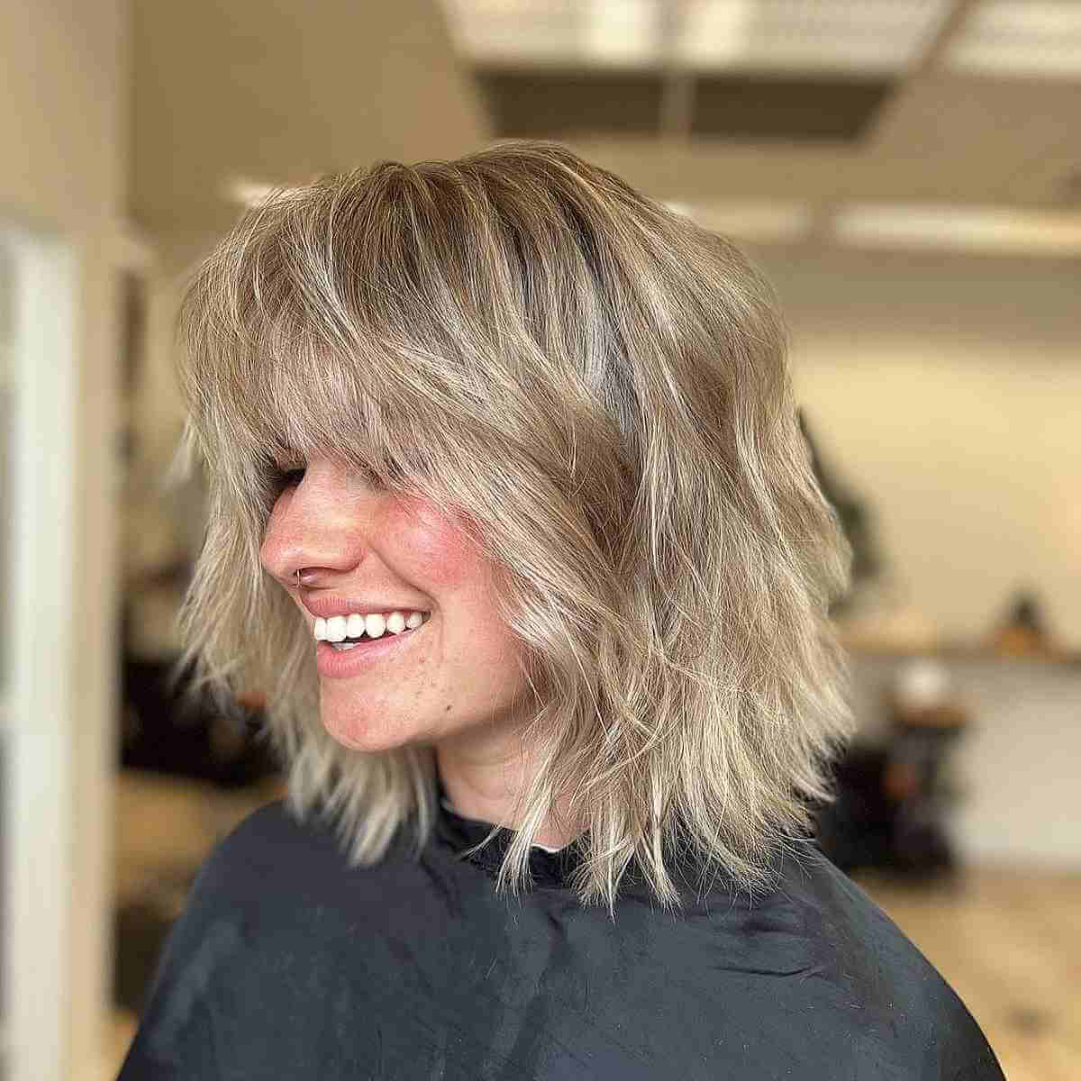 Shoulder-Length Angled Bob with Soft Beach Waves and Bangs