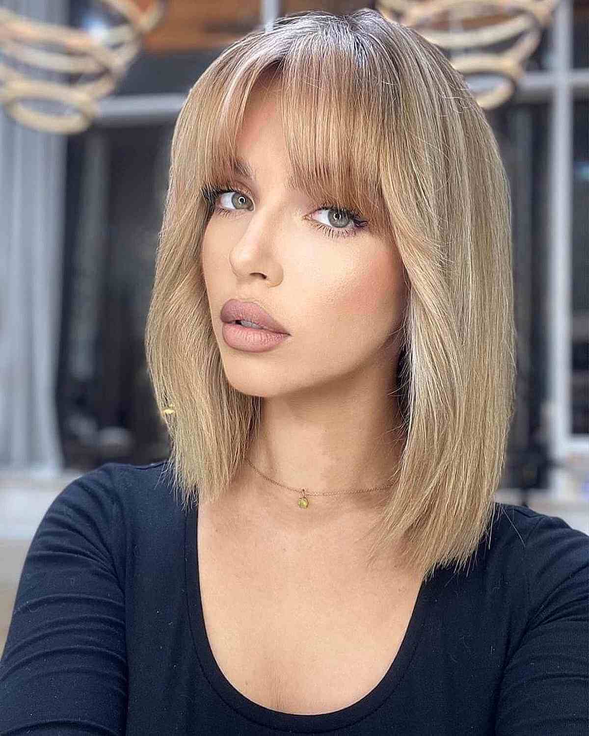 Shoulder-Length Bob with Middle Part Bangs for Thin-Haired Ladies