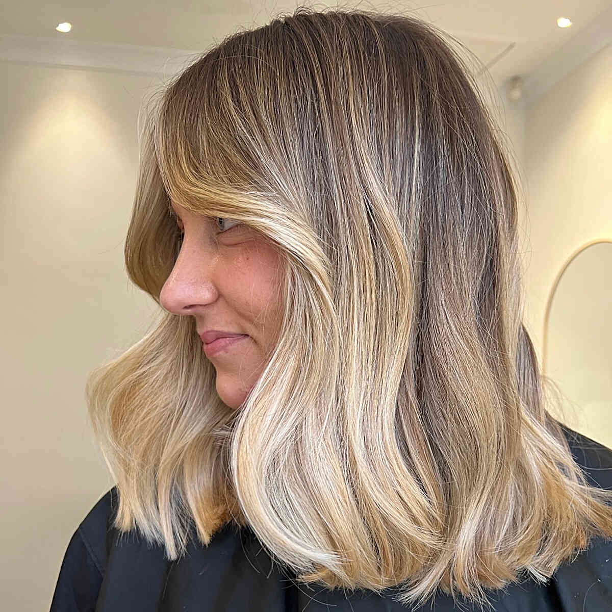 Shoulder-Length Buttery Blonde Balayage Hair with Shadow Root