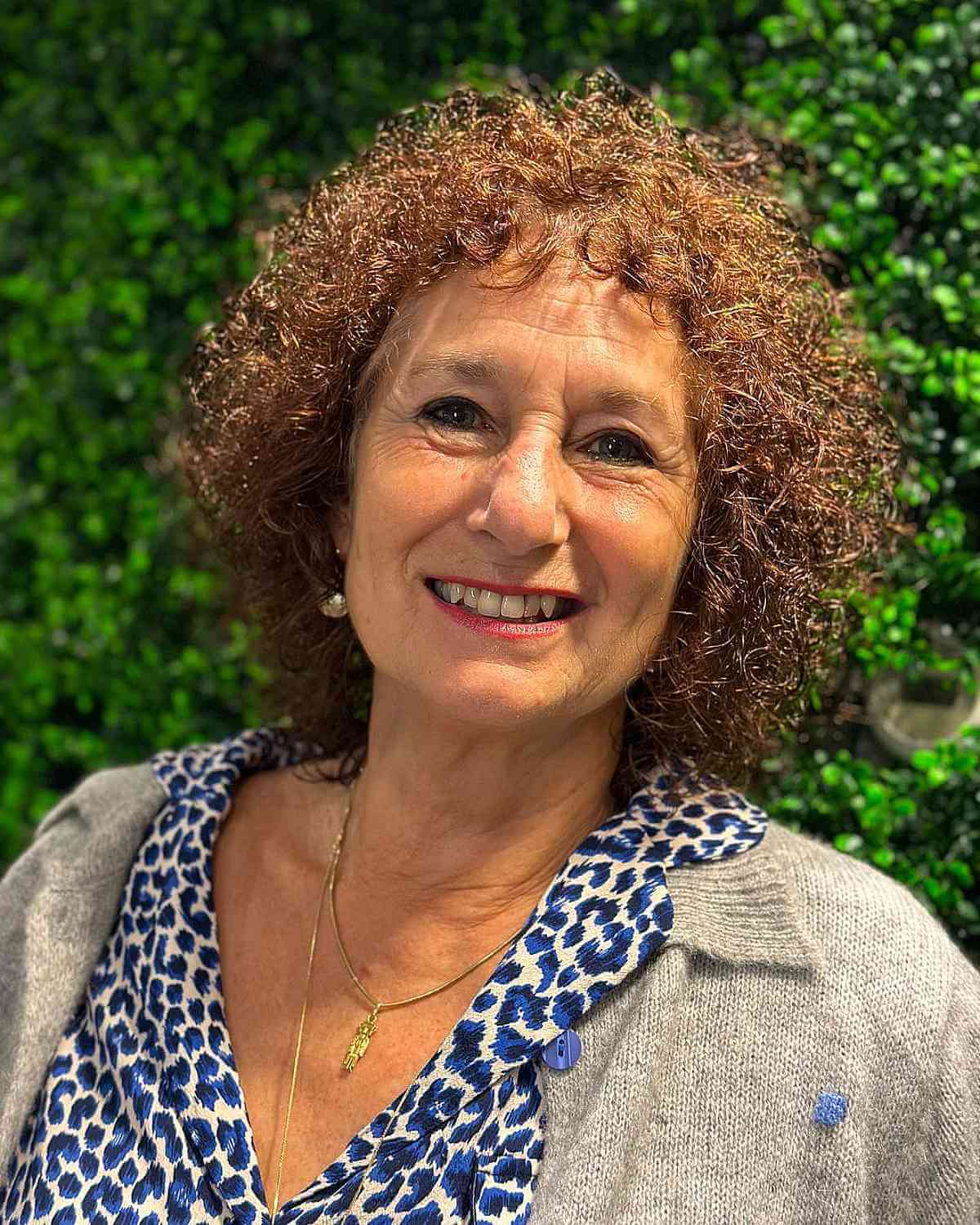 Shoulder-Length Curls and Bangs for Women Over 60