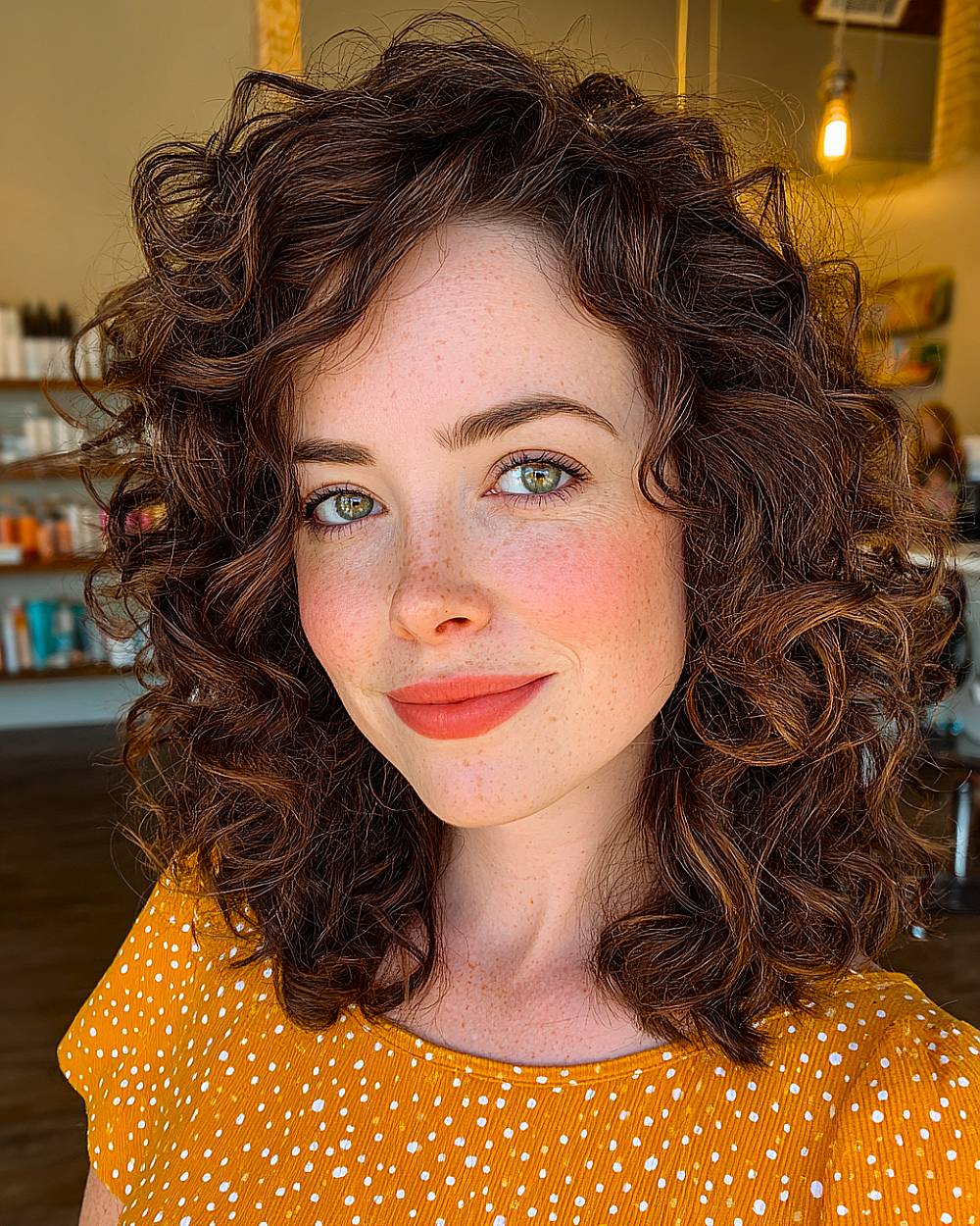 Shoulder-length curly bob hairstyle with defined natural curls and soft layers for medium to thick curly hair