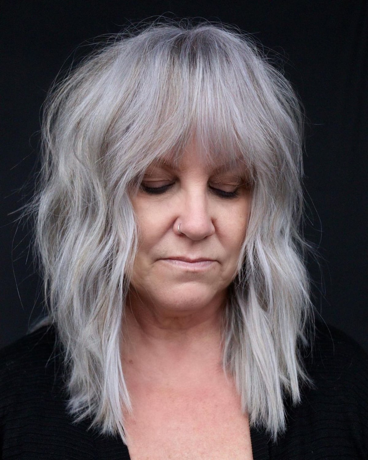Shoulder length edgy shag haircut for women over 60