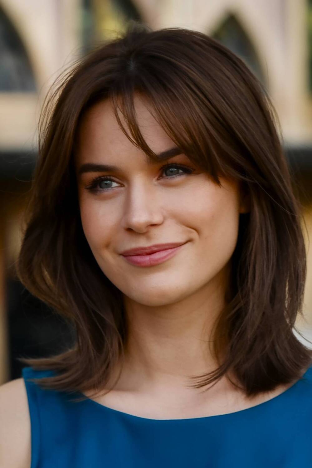 Shoulder-length haircut with choppy layers and wispy bangs for a natural, effortless look