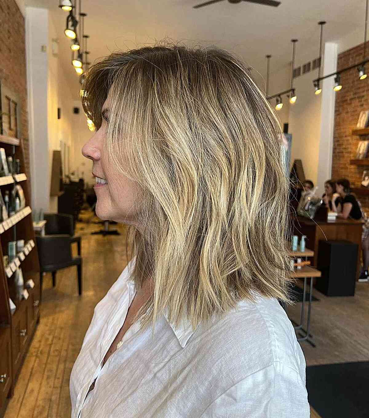Shoulder-Length Layered Haircut with Texture and Dusted Ends