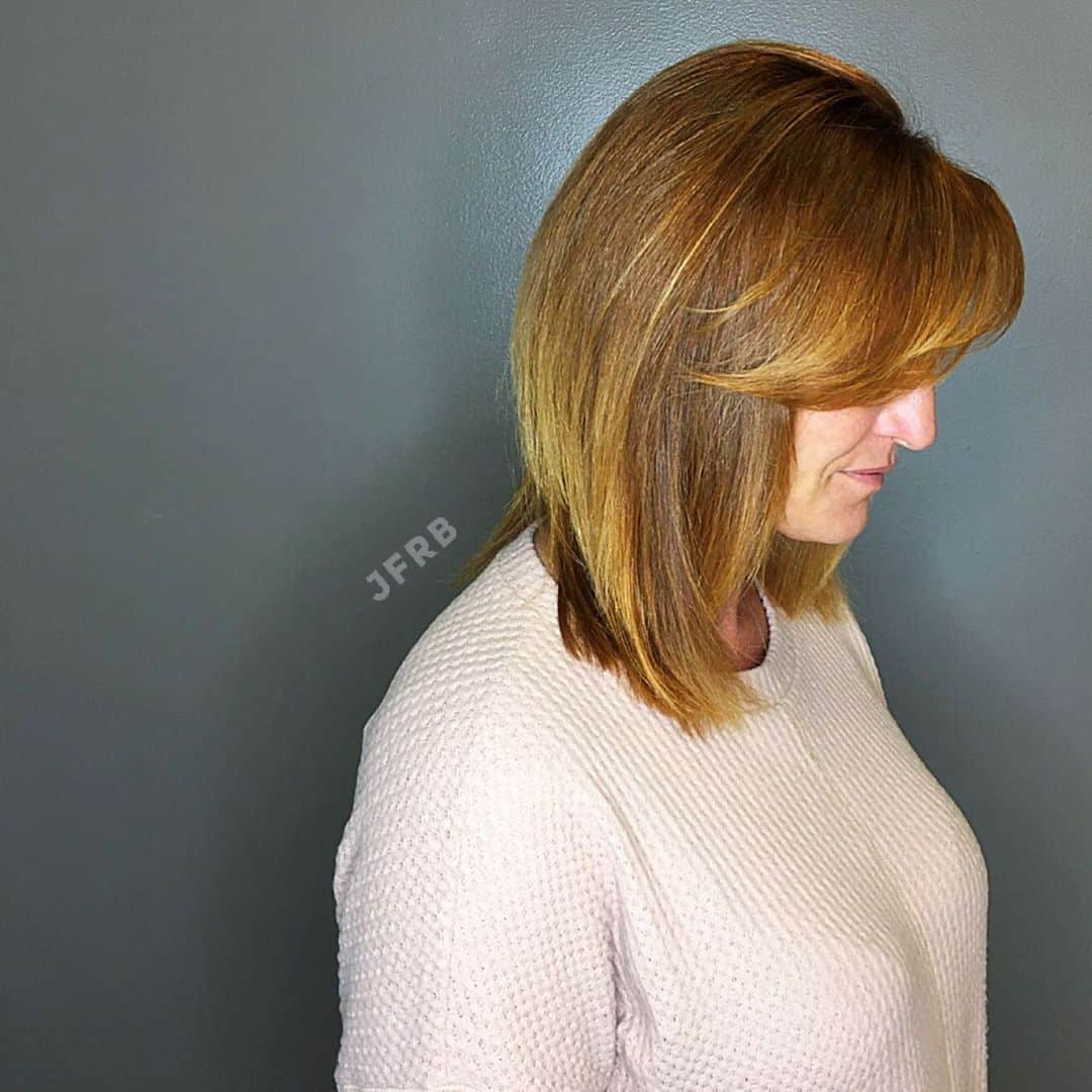 Shoulder-Length Layered Inverted Bob with Side Bangs