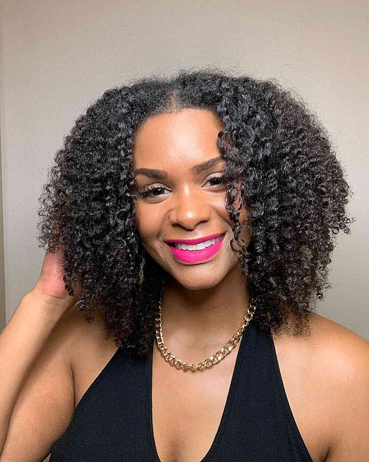 Shoulder-Length Natural Curly Twists with Layers and Middle Part