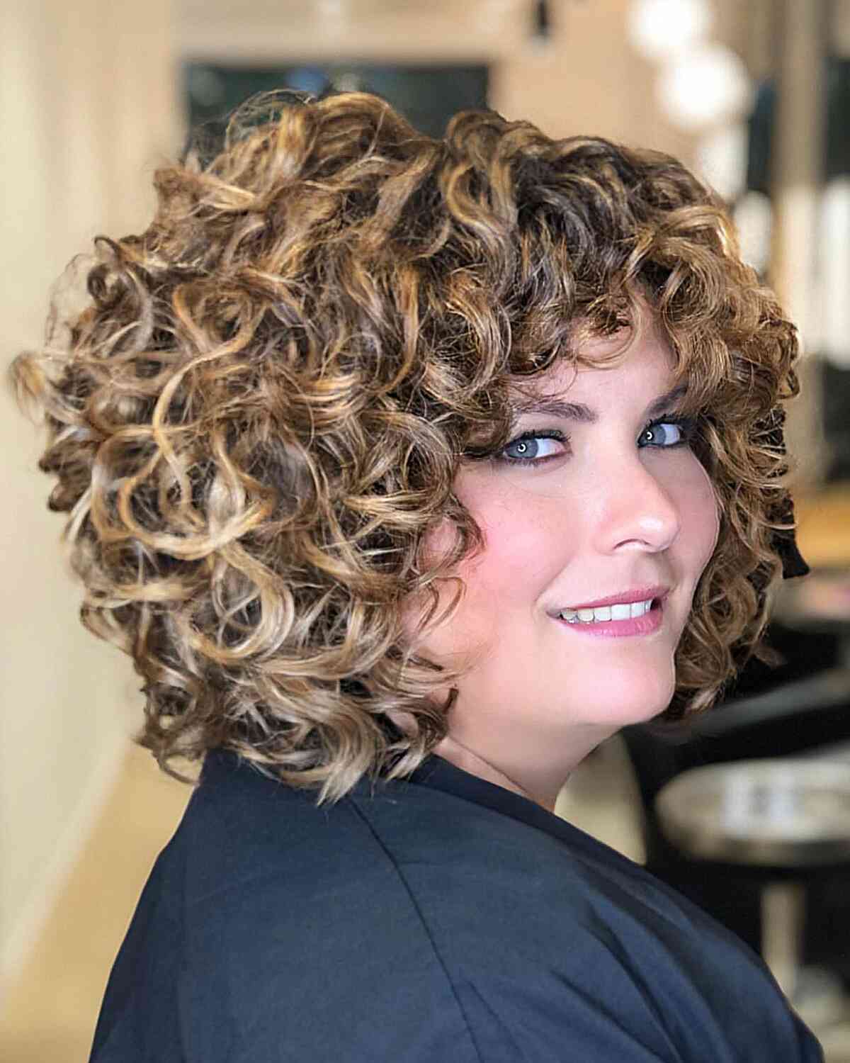 Shoulder-Length Rezo-Cut Curls with Fringe