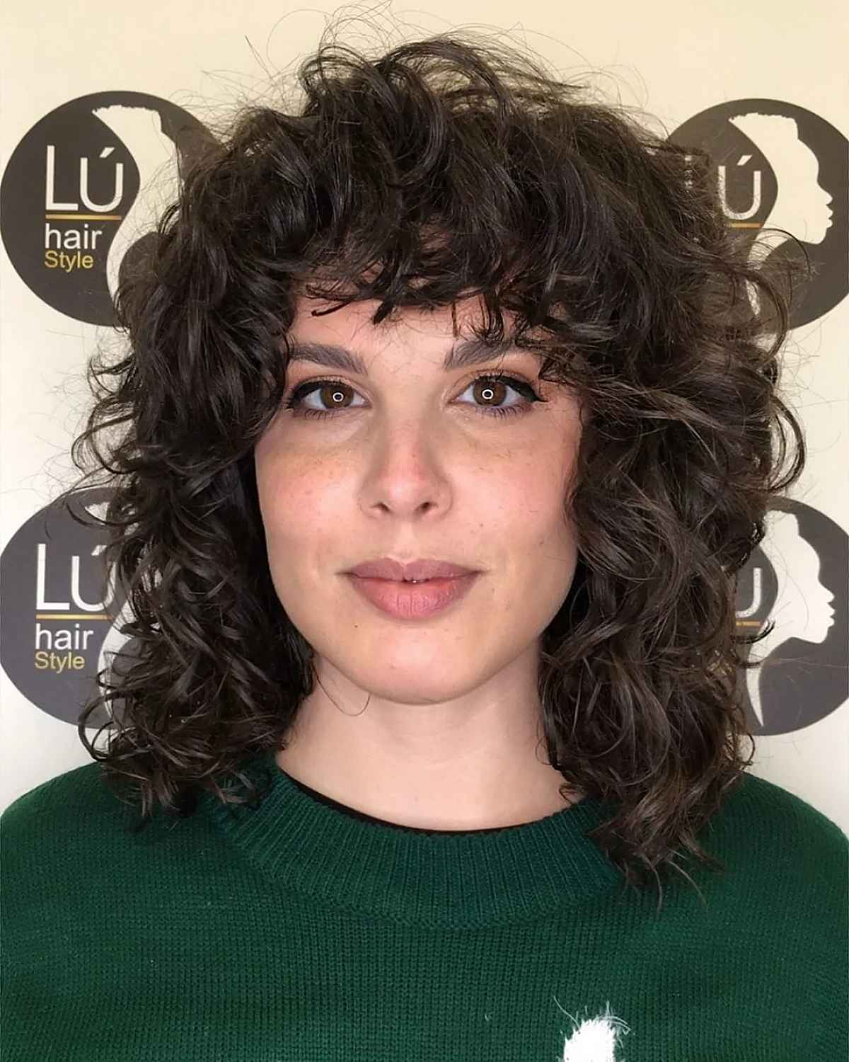 Shoulder-Length Wolf Cut with Big Curls and Waves