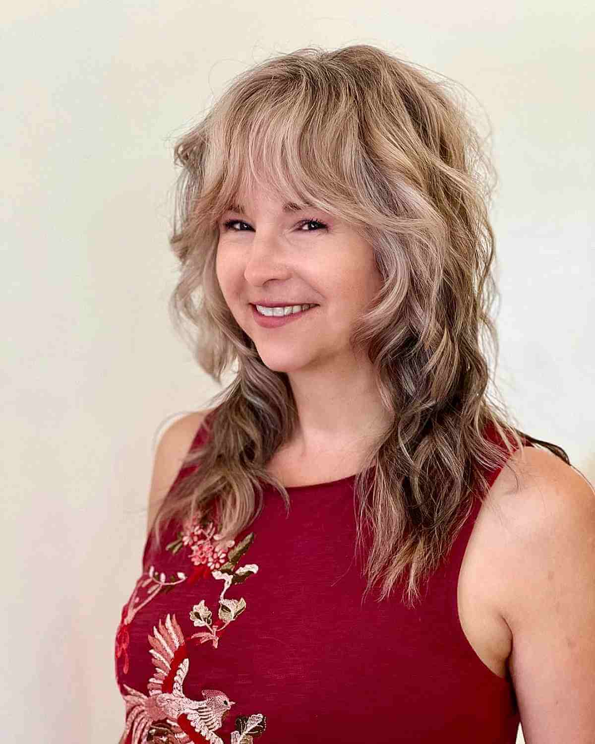 Shullet with Bangs and Loose Waves for a Lady Over 40