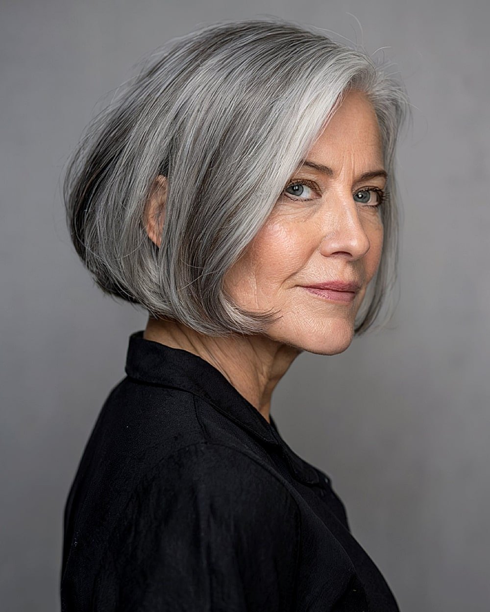 Side part bob with rounded ends and soft gray blend for graceful aging hair