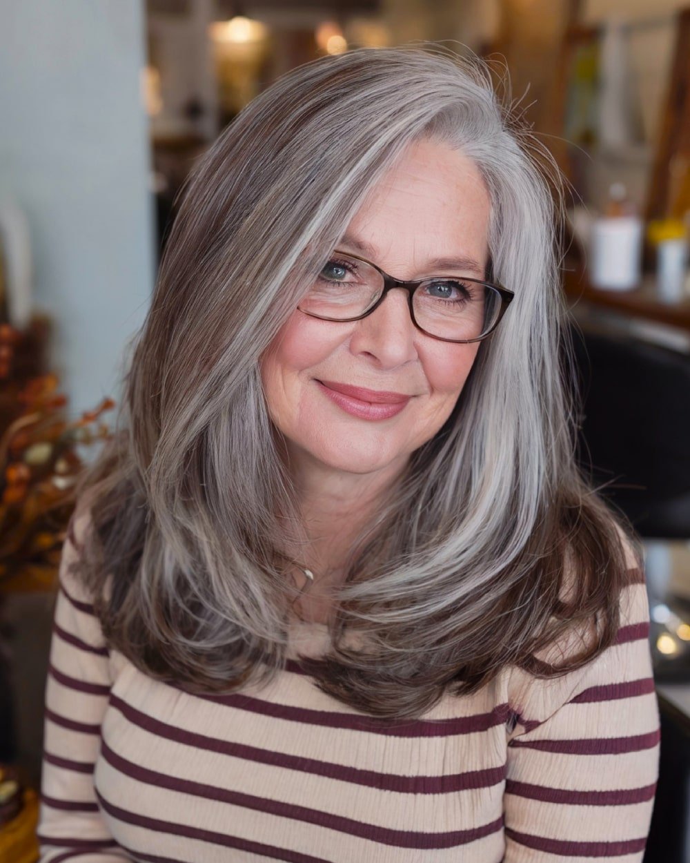 Side part medium length haircut with soft face-framing layers for round faces over 60
