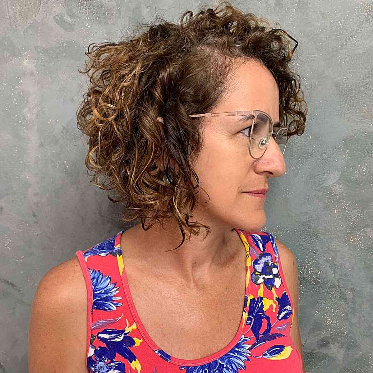 Neck-Length Side Part Stacked Curly Haircut for Mature Ladies with Specs