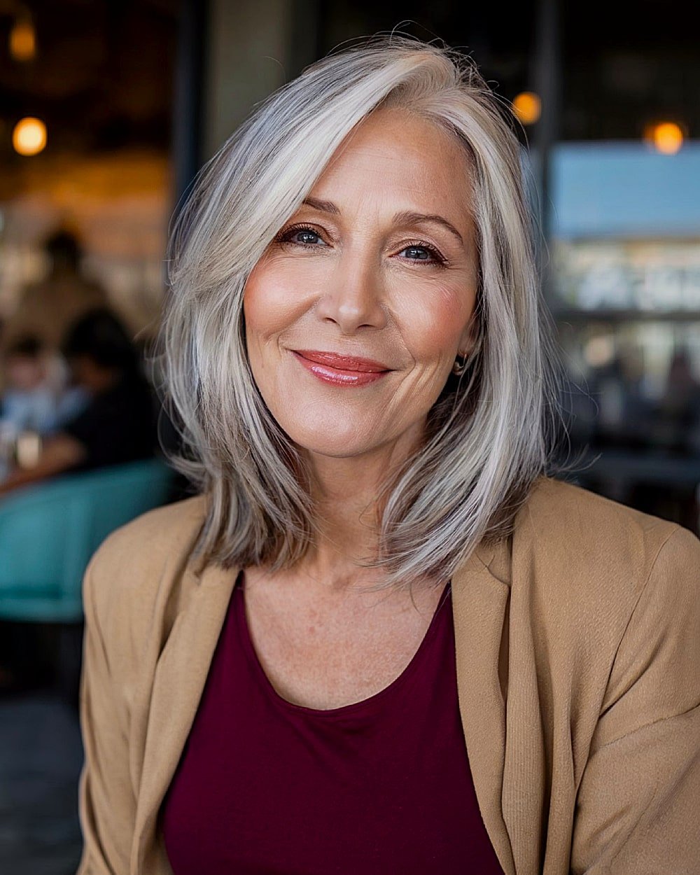 Side part shoulder-length haircut with layers for thin gray hair over 60