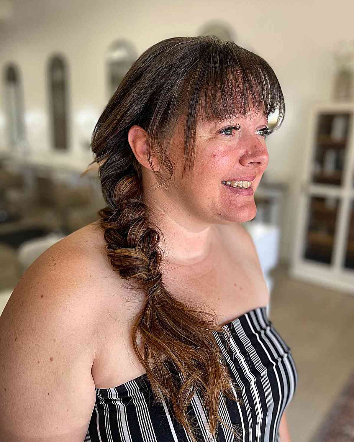 Medium Side-Swept Braided Style with Bangs for Wedding Guests