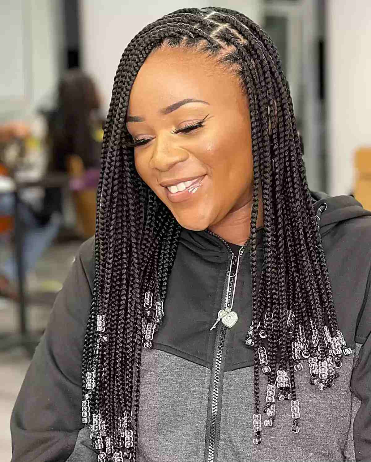 Side-Swept Knotless Box Braids with Beads for Mid-to-Long Hair Length