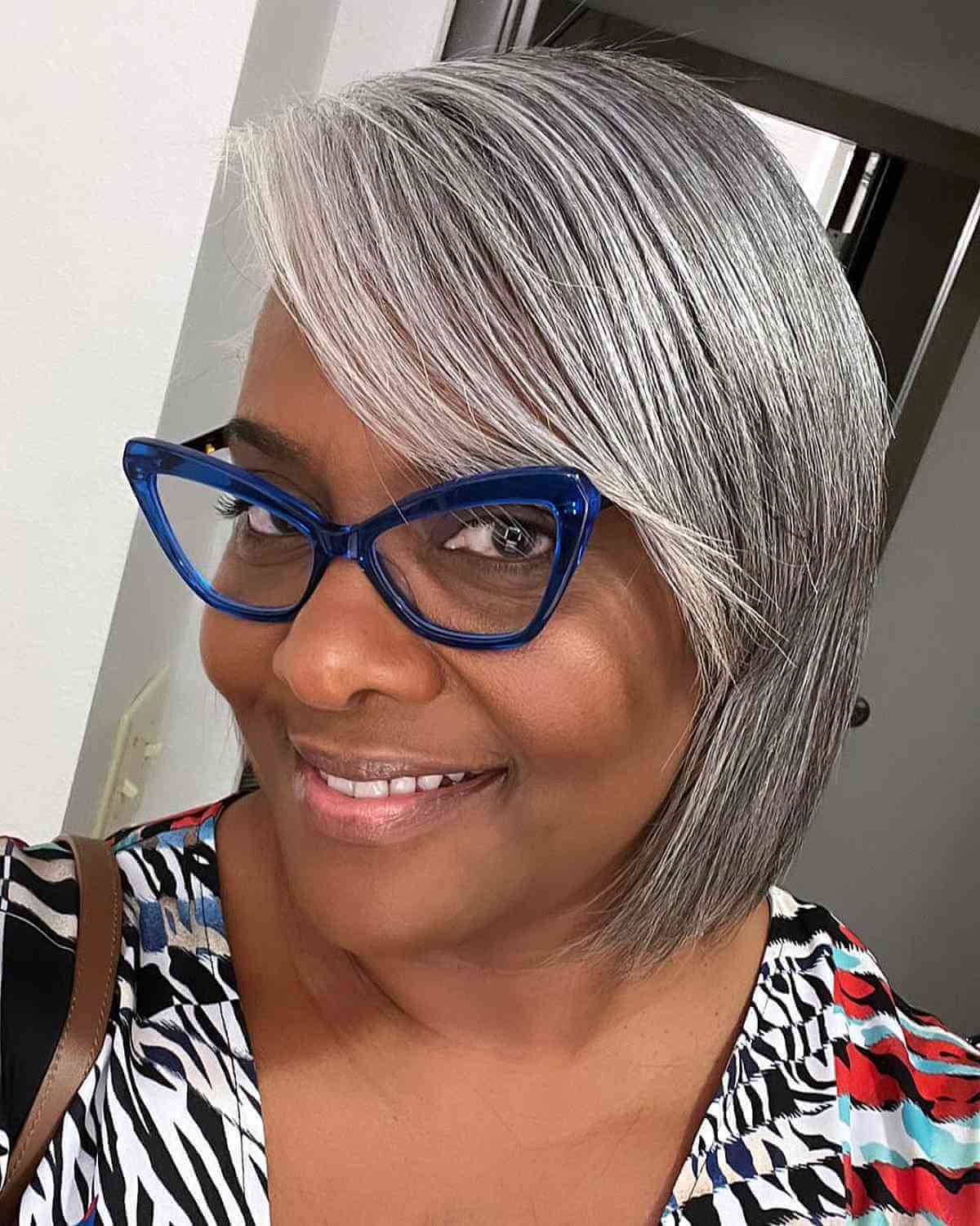 Side-Swept Silver Bangs and Cut for 50-Year-Olds with Glasses