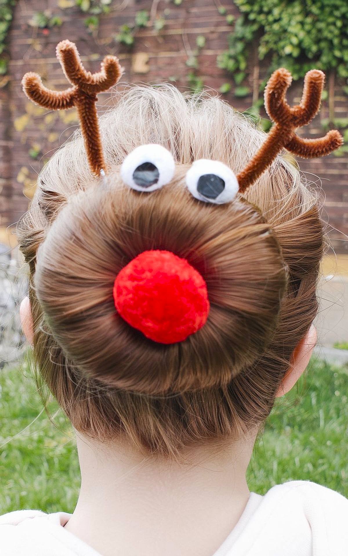 Reindeer-themed hair bun with antlers and a red nose made from hair accessories