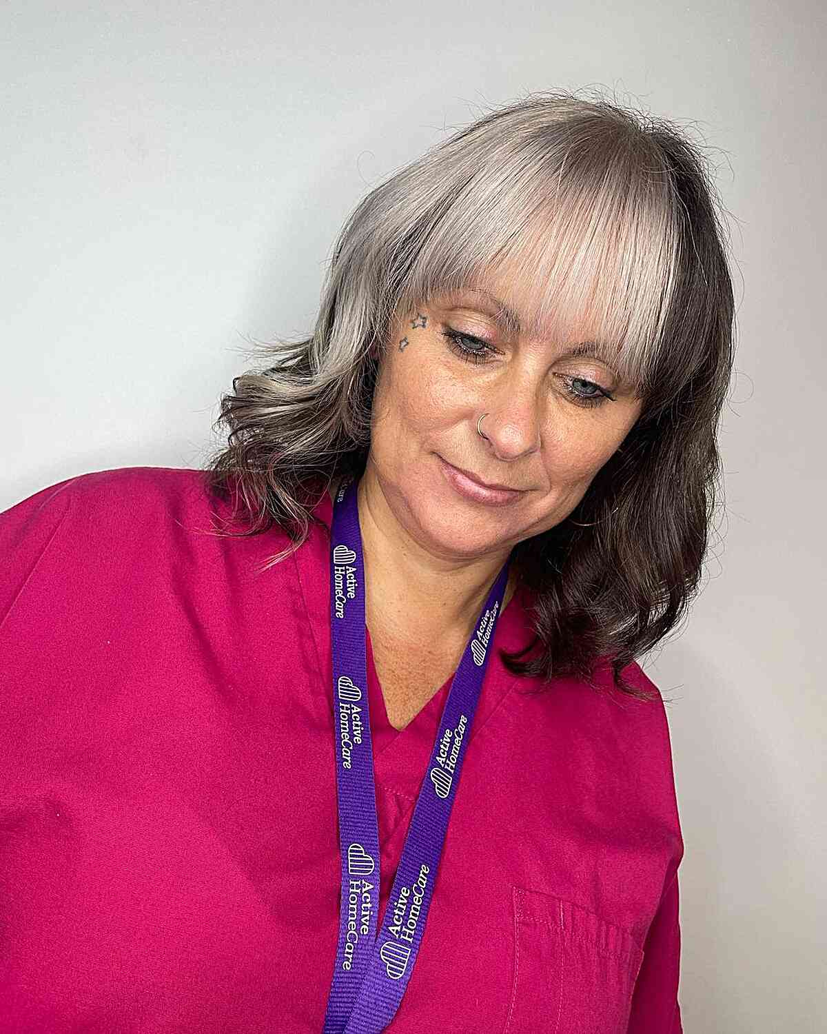 Silver and Brown Color Block on Shoulder-Length Hair for Women Over 60