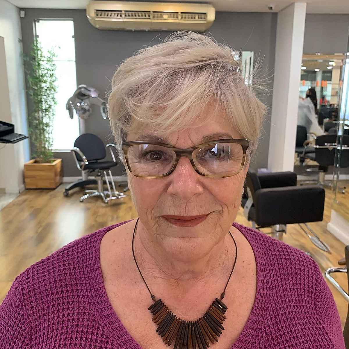 Silver Pixie Cut with Bangs and Glasses