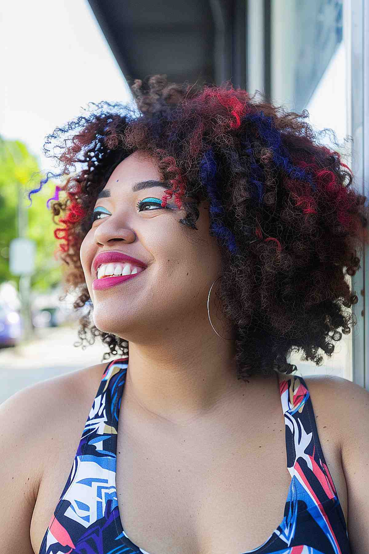 Natural coily hair with red and blue highlights for 4th of July