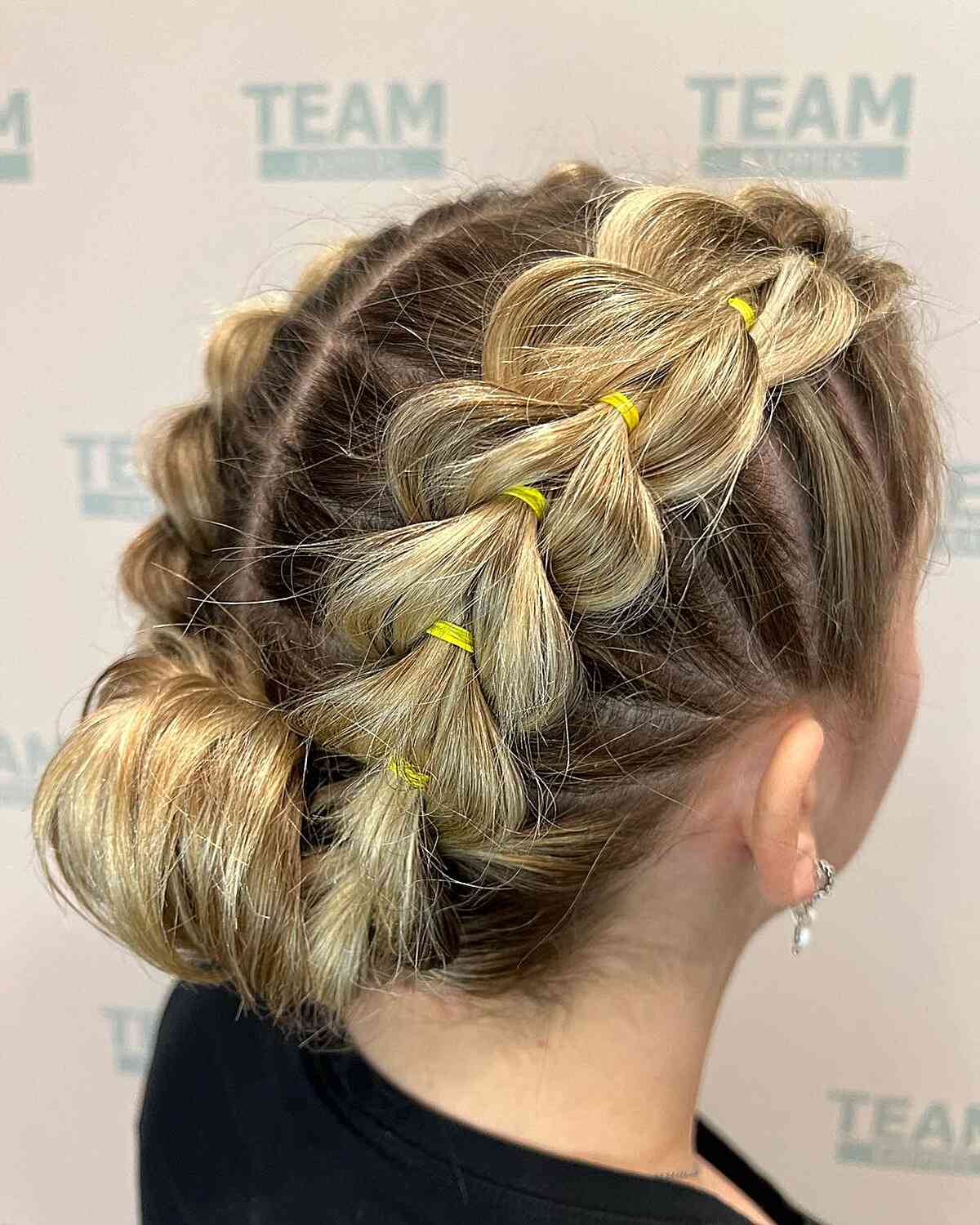 Simple Double Pull-Through Braids and a Roll Bun for Blondes with Medium Hair