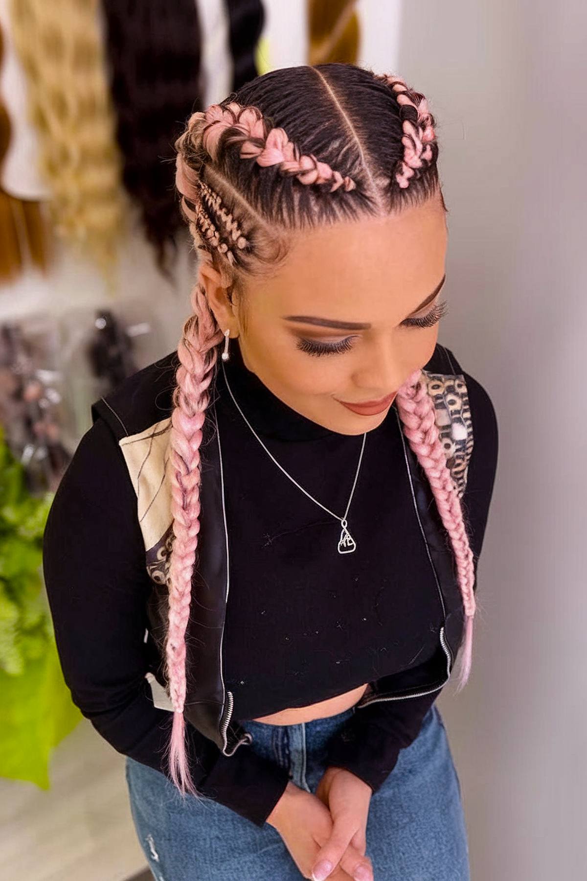 Simple pink Dutch braids for a subtle rave hairstyle