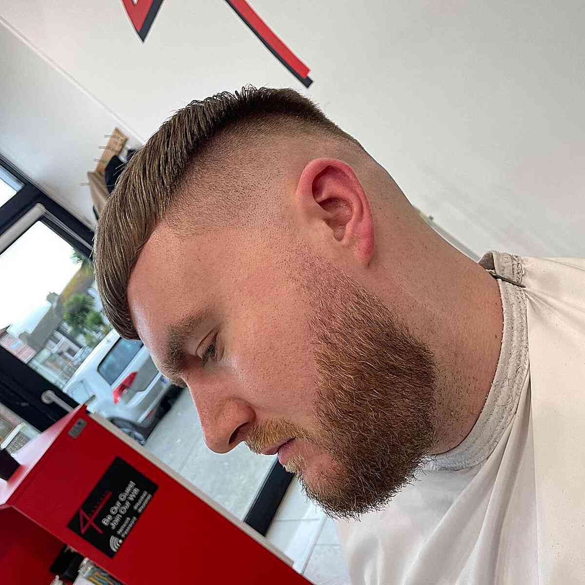 Skin Fade and Disconnected Undercut on Short Hair for Men with Beard