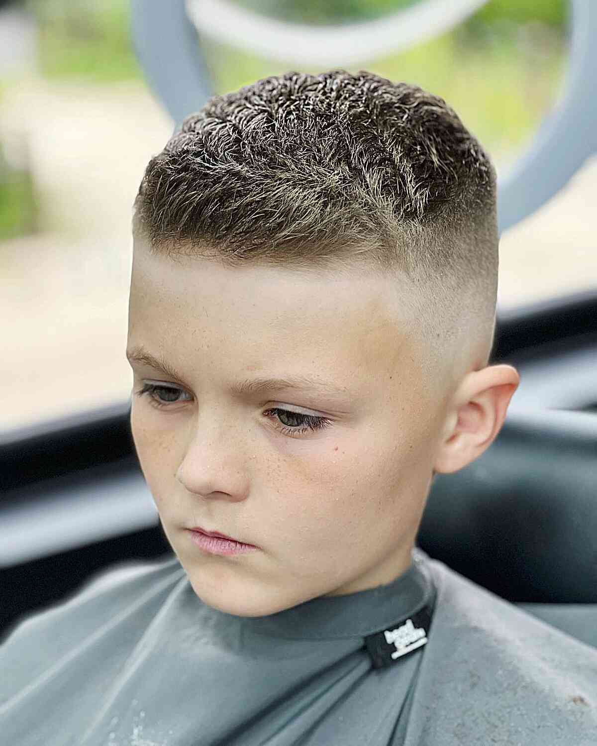 Skin Fade with a Textured Short Top for Boys with very short hair