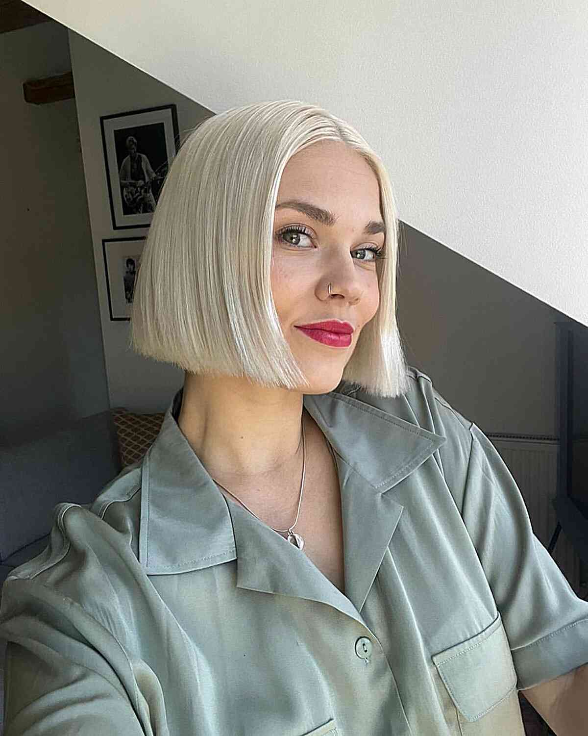 Sleek and Blunt Short Blonde Bob with a middle part