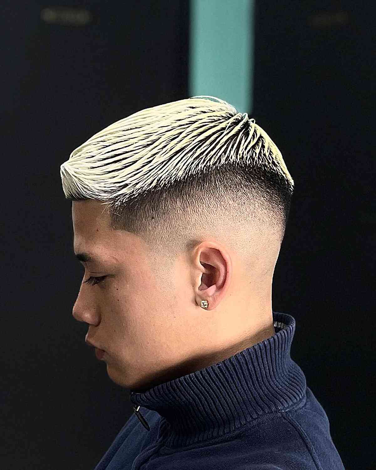 Sleek Blonde Quiff with Piece-y Texture and Disconnected Skin Fade