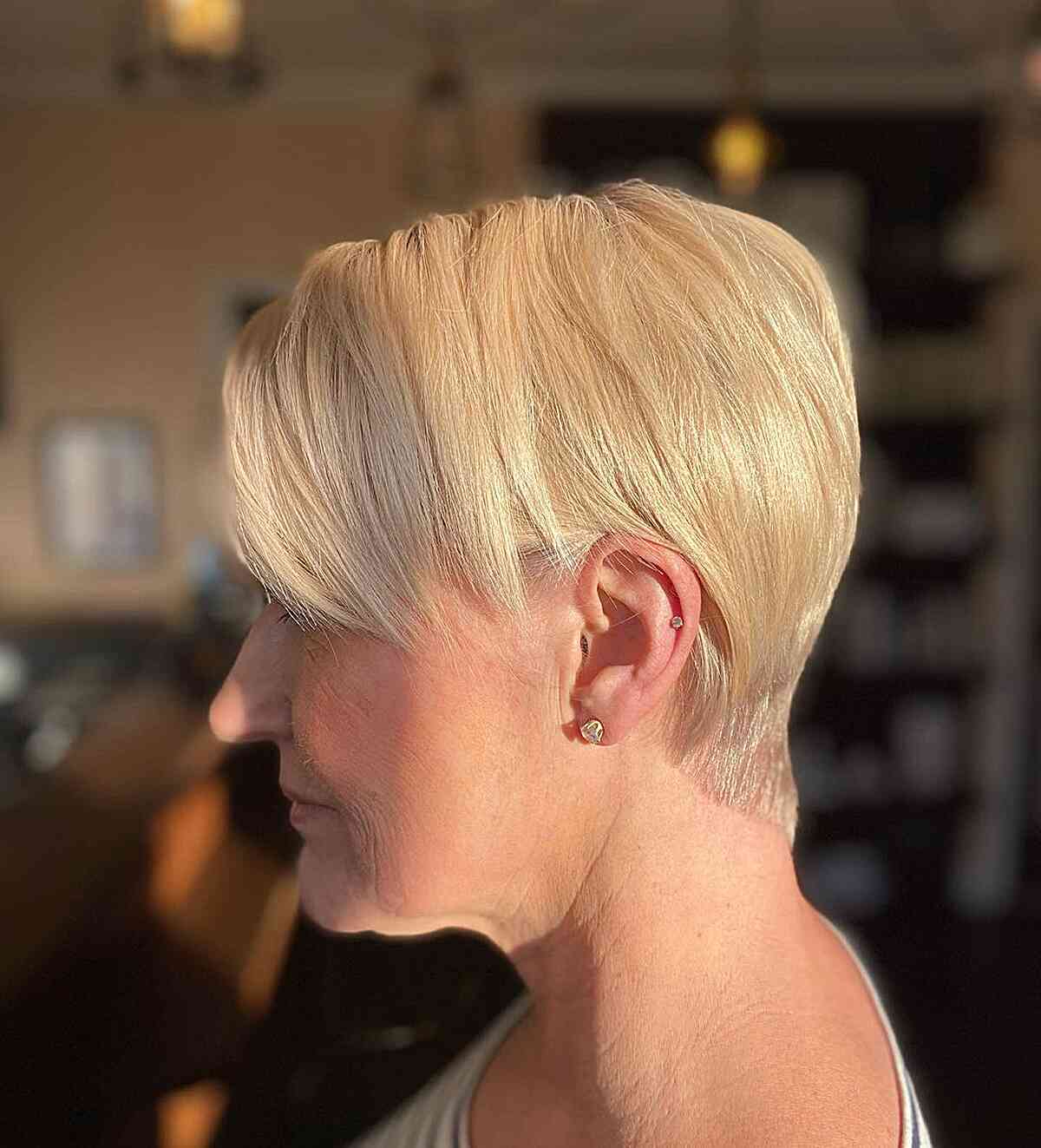 Sleek Blonde Tapered Pixie with Side Bangs on Older Women with Straight Hair