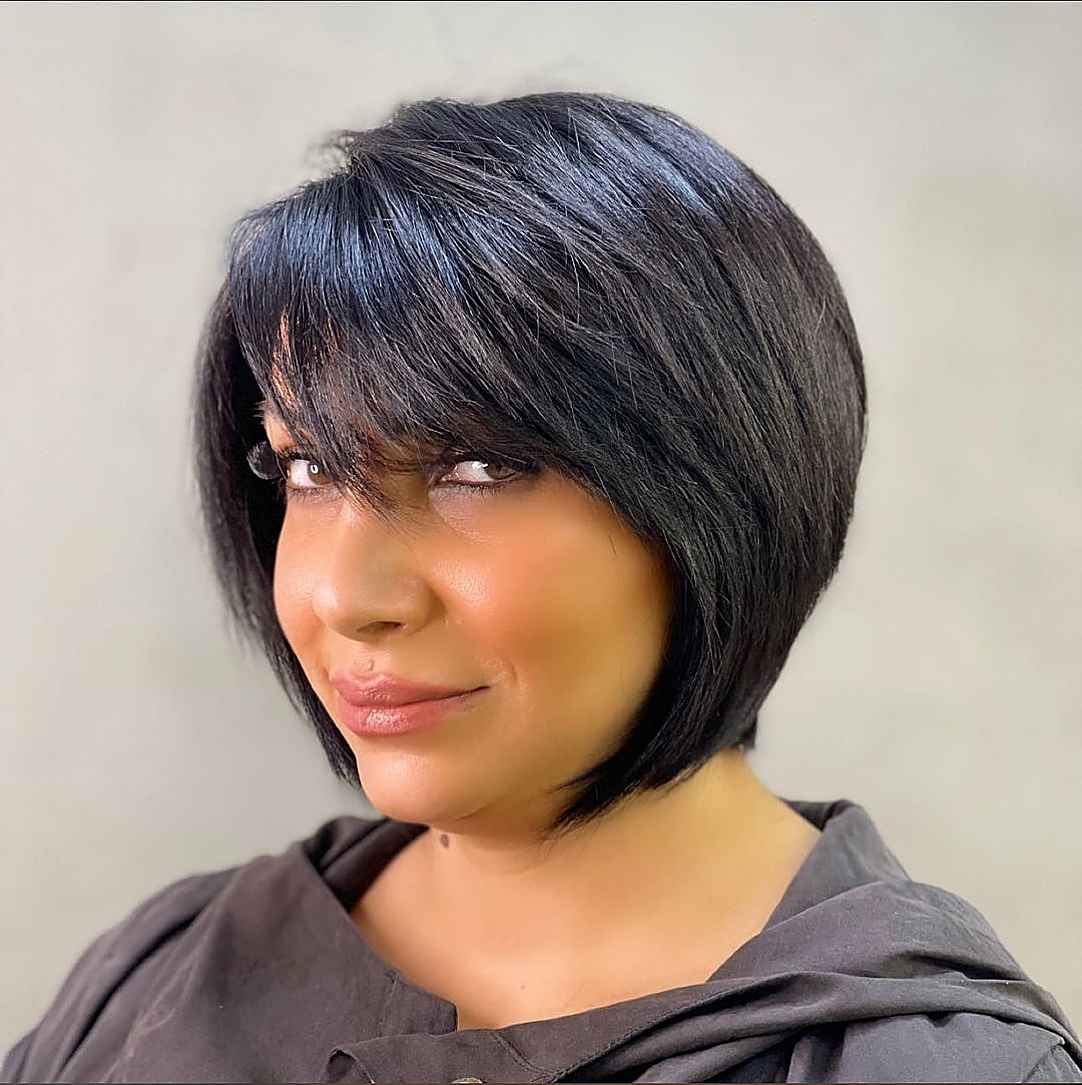 sleek bob with side bangs for round faces