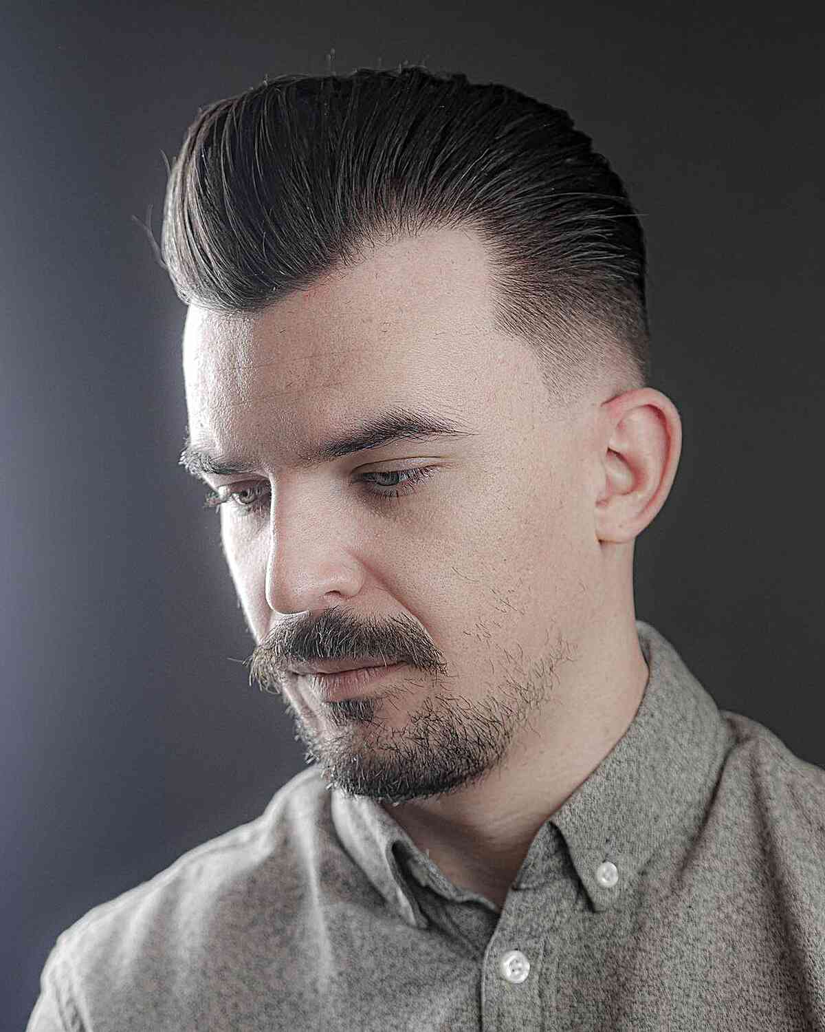 Sleek Brushed Back Pomp with Faded Sides for Men with Widow's Peak Hairline